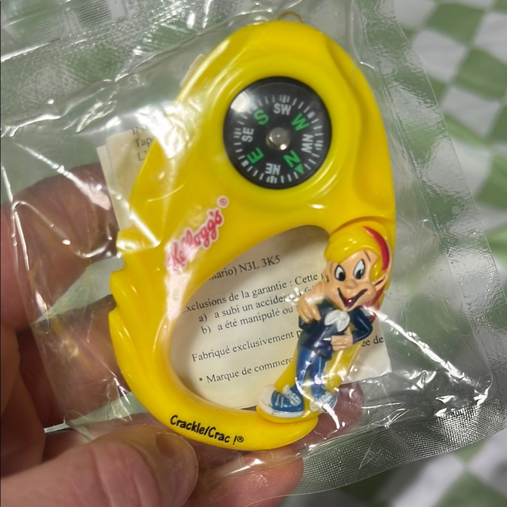 Kelloggs vintage Yellow Compass with Cartoon Character